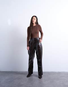 Model wearing Slinky long sleeve knot back detail bodysuit in chocolate