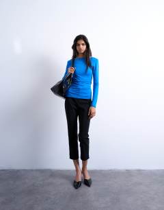 Model wearing Slinky scoop back long sleeve top in cobalt blue