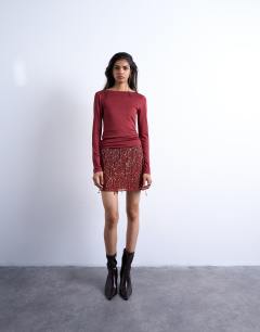 Model wearing Slinky scoop back long sleeve top in dark red