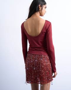 Model wearing Slinky scoop back long sleeve top in dark red