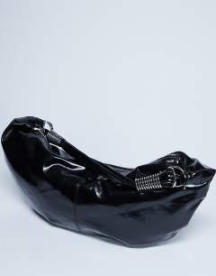 Model wearing Sloane hardware scoop shoulder bag in black