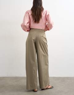 Model wearing Smart casual techy wrap buckle detail trouser in mushroom