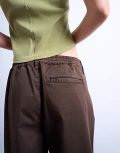 Model wearing Smart hybrid casual trouser in chocolate