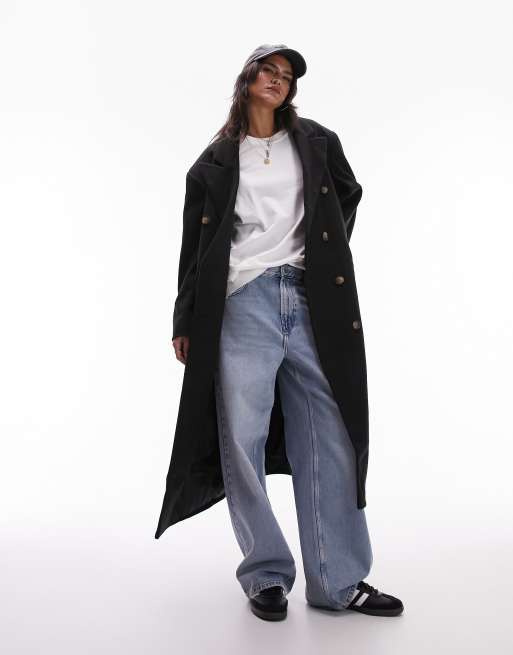 Topshop long black maxi coat in an oversized fit. It has a Brushed finish, Peak lapels, a button placke, drop shoulders, Pocket detail, Centre vent
and an Oversized fit. 