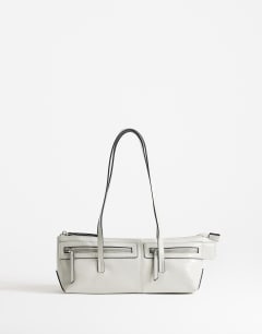 Model wearing Snoopy small zip front pocket shoulder bag in light grey