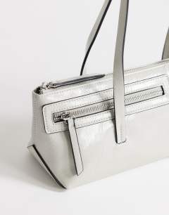 Model wearing Snoopy small zip front pocket shoulder bag in light grey