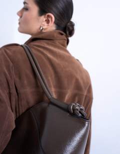 Model wearing Sofia shoulder bag in khaki