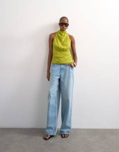 Model wearing Soft funnel halter neck top in green check