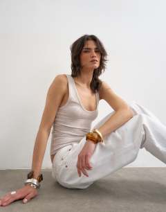Model wearing Soft racer back scoop neck vest in oat