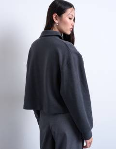 Model wearing Soft touch boxy long sleeve polo co-ord in grey