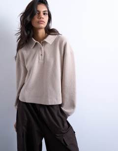 Model wearing Soft touch boxy long sleeve polo in taupe