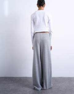 Model wearing Soft touch brushed pintuck trousers in grey