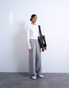 Model wearing Soft touch brushed pintuck trousers in grey