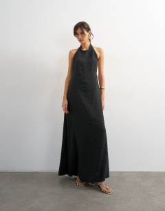 Model wearing Soft touch cupro halter neck low back maxi dress in washed black
