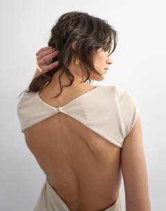 Model wearing Soft touch double layer cupro cut out maxi in beige