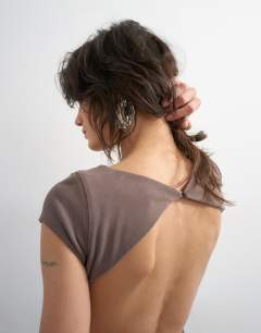 Model wearing Soft touch double layer cupro cut out maxi in khaki