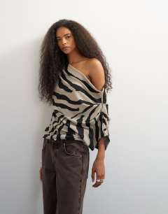 Model wearing Soft touch drape shoulder top in zebra print