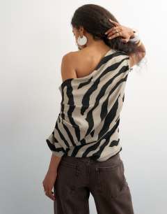 Model wearing Soft touch drape shoulder top in zebra print