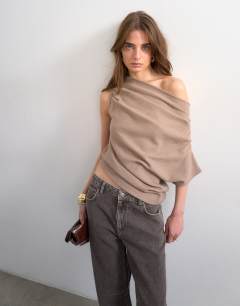 Model wearing Soft touch fallen shoulder top in taupe