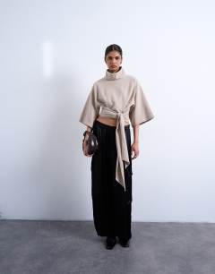 Model wearing Soft touch funnel neck tie waist detail top in taupe