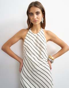 Model wearing Soft touch halter neck low back maxi dress in woven mono stripe
