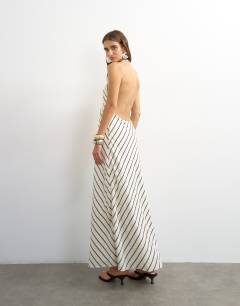 Model wearing Soft touch halter neck low back maxi dress in woven mono stripe