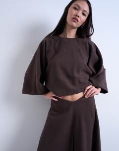 Model wearing Soft touch hanky hem asymmetric skirt co-ord in chocolate