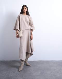 Model wearing Soft touch hanky hem asymmetric skirt co-ord in taupe