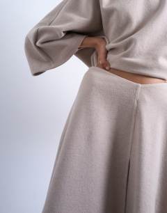 Model wearing Soft touch hanky hem asymmetric skirt co-ord in taupe