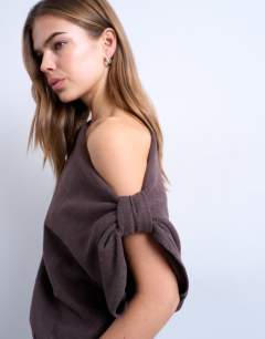 Model wearing Soft touch off shoulder knot side long sleeve top in chocolate