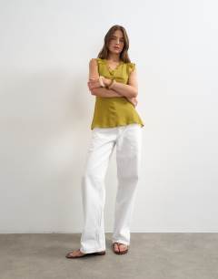 Model wearing Soft v neck ruffle sleeve tea blouse in green