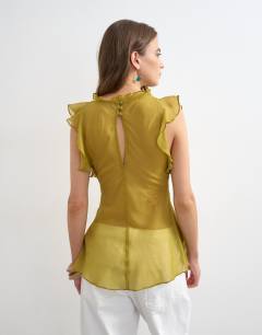 Model wearing Soft v neck ruffle sleeve tea blouse in green