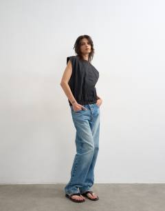Model wearing Soft zip through structured shoulder top in black 