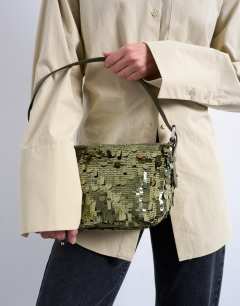 Model wearing Sol shoulder sequin bag with leather handle in khaki