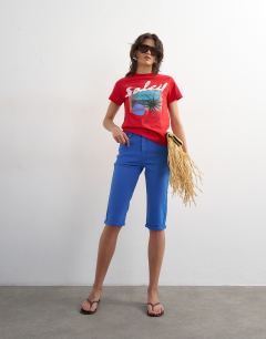 Model wearing Soleil graphic boxy tee in red