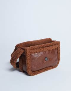 Model wearing Solo borg trim shoulder bag in tan
