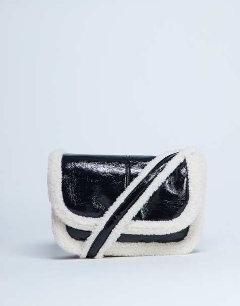 Topshop - Solo - Sac porté épaule avec bordures en imitation peau de mouton - Noir/blanc - view 1
