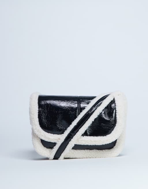 Topshop - Solo schoudertas met borgafwerking in zwart-wit