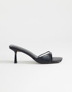 Sophie asymmetric mid heel mule in black
