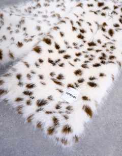 Model wearing Sophie faux fur scarf in dalmatian