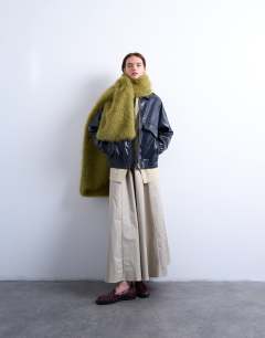 Model wearing Sophie faux fur scarf in green