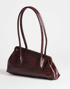 Model wearing Sophie medium angular shoulder bag in chocolate