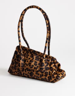 Model wearing Sophie medium hair on real leather angular shoulder bag in leopard print
