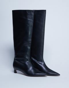 Model wearing Sophie Premium leather point toe knee high boot in black