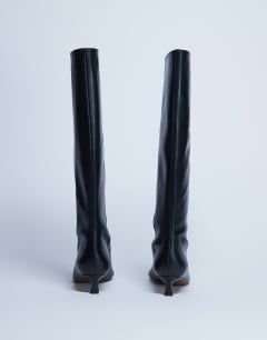 Model wearing Sophie Premium leather point toe knee high boot in black