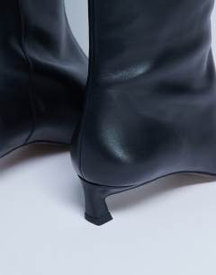 Model wearing Sophie Premium leather point toe knee high boot in black