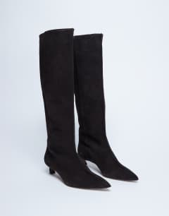 Model wearing Sophie Premium leather point toe knee high boot in chocolate