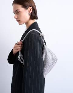 Model wearing Sparkles diamante shoulder bag in silver