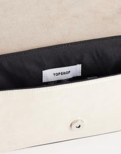 Model wearing Spencer medium strap detail shoulder bag in stone
