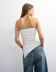 Model wearing Split side ruched asymmetric bandeau in ivory